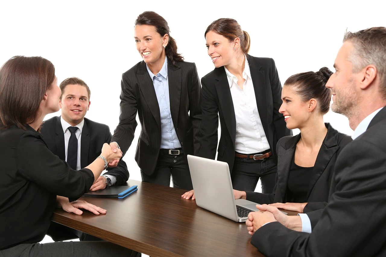 Business women at a meeting shaking hands
