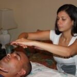 Reiki student giving a Reiki treatment